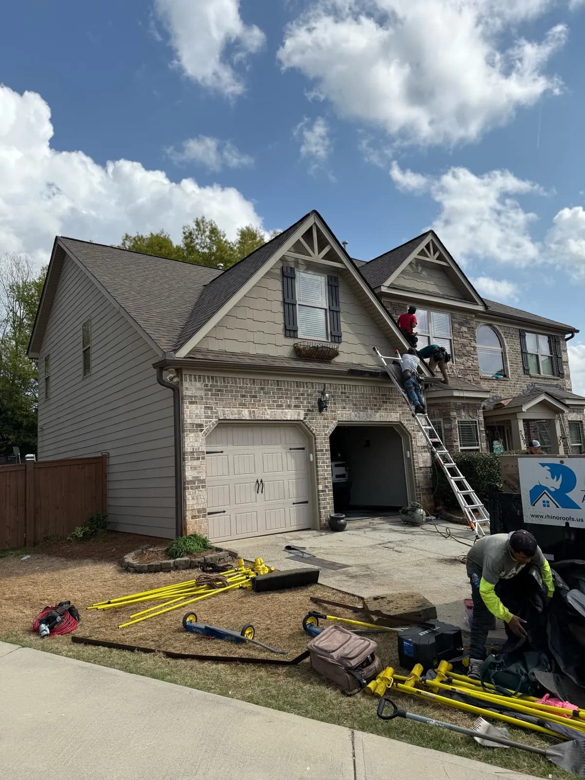 Rhino Roofing crew completing residential roof work